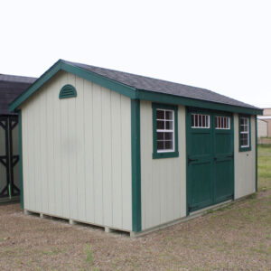 10 x 16 foot cottage workshop shed painted in light green with darker green doors and trim