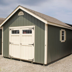 12x16 foot, green cape cod style shed with cream colored double door in front and window on the side