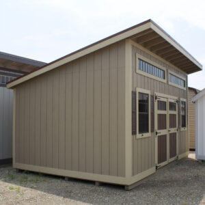 beige colored lean to style shed with brown and tan doors
