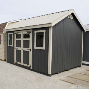 Dark Grey Cape Cod shed with sandstone trim