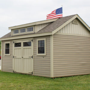12x16 ft beige shed with dormer windows